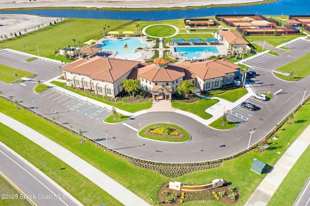 drone / aerial view with a water view and a residential view