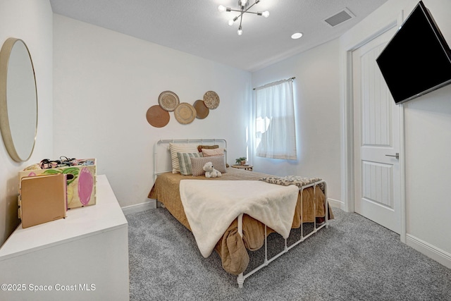 carpeted bedroom with baseboards and visible vents