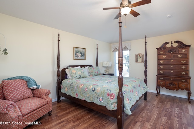 bedroom with lofted ceiling, ceiling fan, baseboards, and wood finished floors