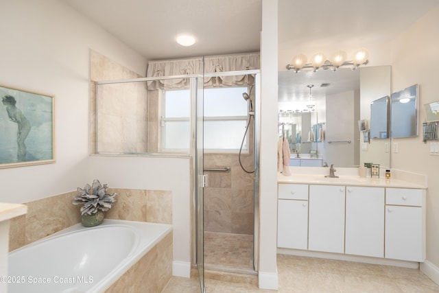 bathroom featuring a garden tub, a shower stall, vanity, and tile patterned floors