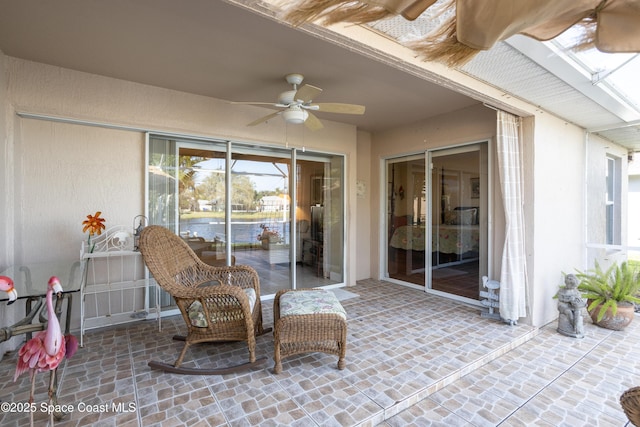 view of patio / terrace featuring ceiling fan