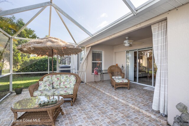 sunroom / solarium with a skylight and ceiling fan