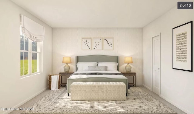 carpeted bedroom featuring baseboards