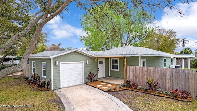 ranch-style home with an attached garage, driveway, and fence