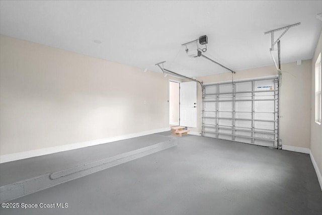 garage featuring baseboards