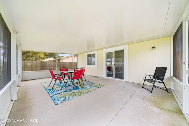 view of patio / terrace with outdoor dining space and fence