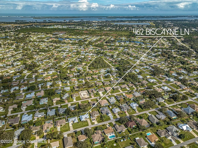 birds eye view of property featuring a water view and a residential view