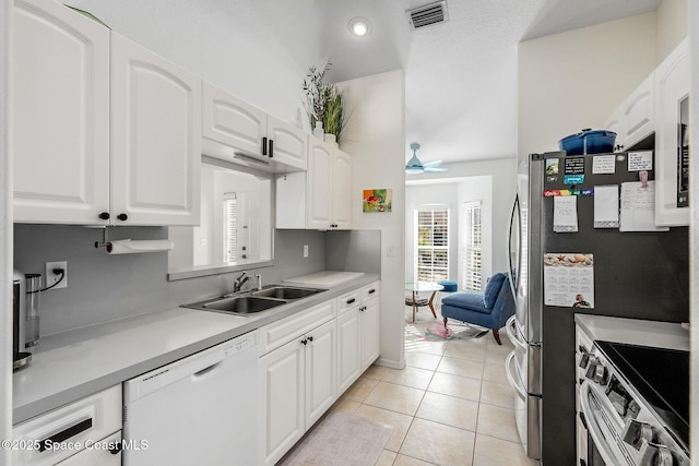 kitchen with visible vents, white cabinets, electric range oven, dishwasher, and light countertops