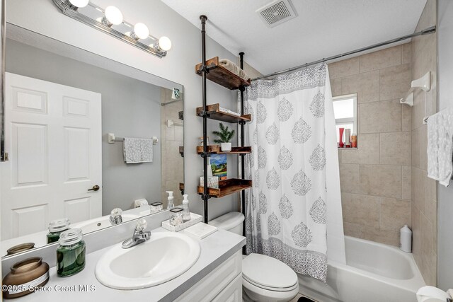bathroom with toilet, shower / bath combination with curtain, vanity, and visible vents