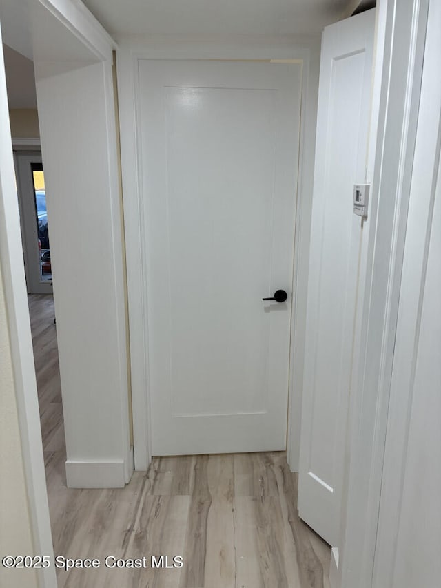 hallway featuring light wood finished floors