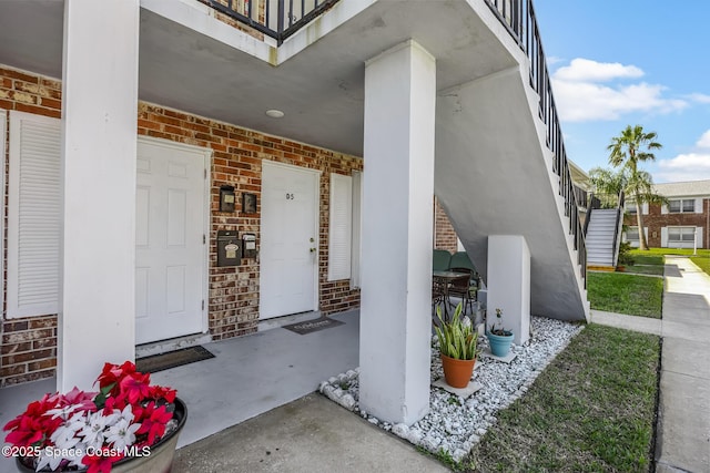 property entrance with brick siding