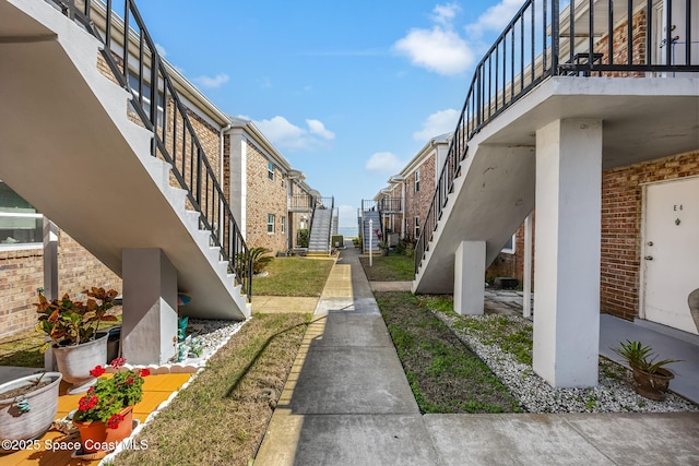 view of community featuring stairs