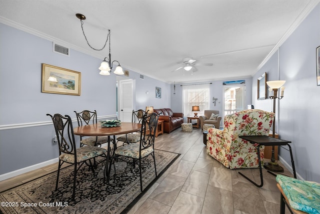 dining area with ceiling fan with notable chandelier, ornamental molding, visible vents, and baseboards