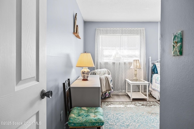 bedroom featuring wood finished floors