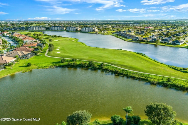 birds eye view of property with a water view and view of golf course