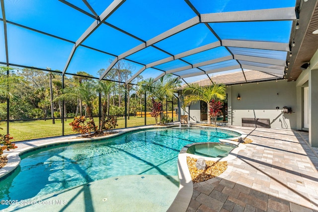 view of swimming pool with glass enclosure, a pool with connected hot tub, a lawn, and a patio