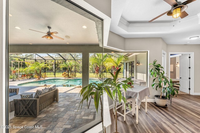 outdoor pool featuring ceiling fan