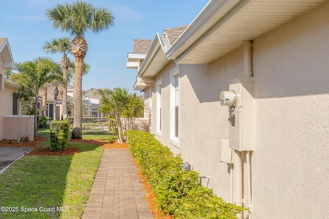 view of side of home featuring stucco siding