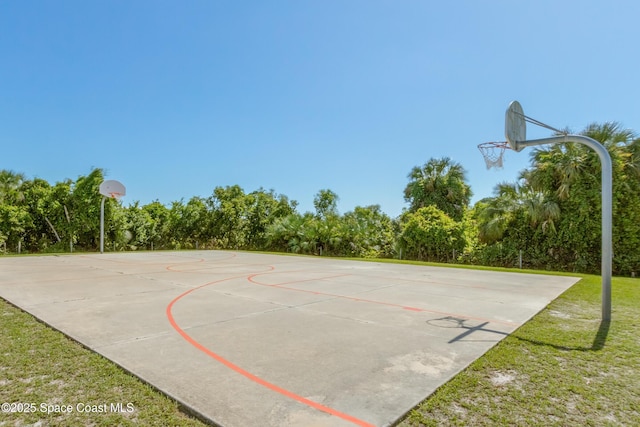 view of sport court featuring community basketball court and a yard