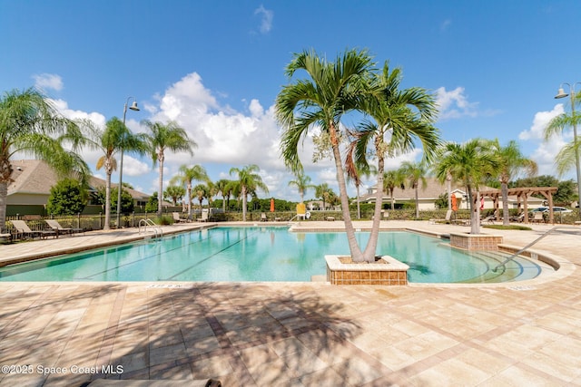 pool featuring a patio area and a pergola