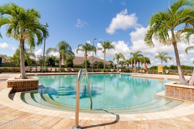 community pool featuring fence