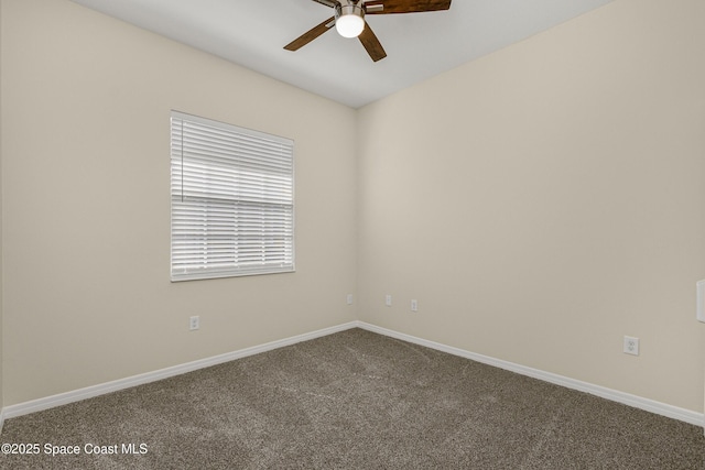 unfurnished room with carpet, ceiling fan, and baseboards