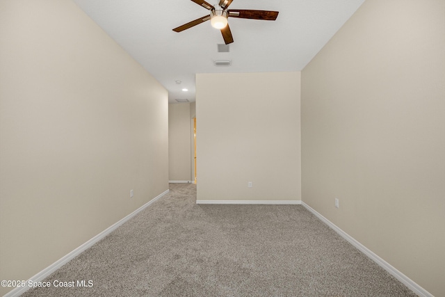 carpeted spare room with baseboards, a ceiling fan, and recessed lighting