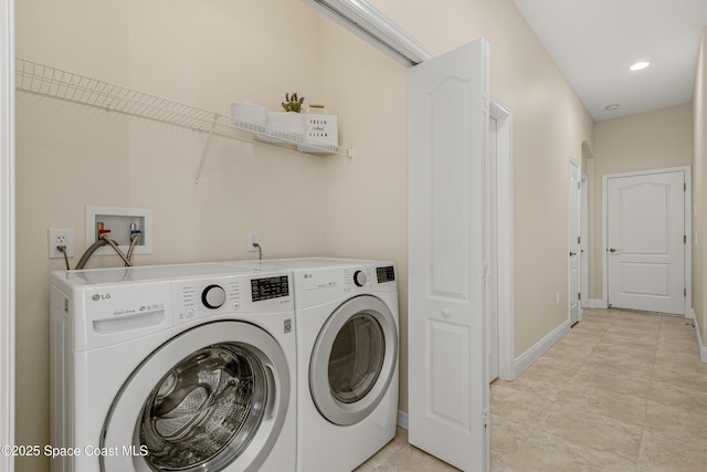 laundry area with laundry area, recessed lighting, baseboards, and washing machine and clothes dryer