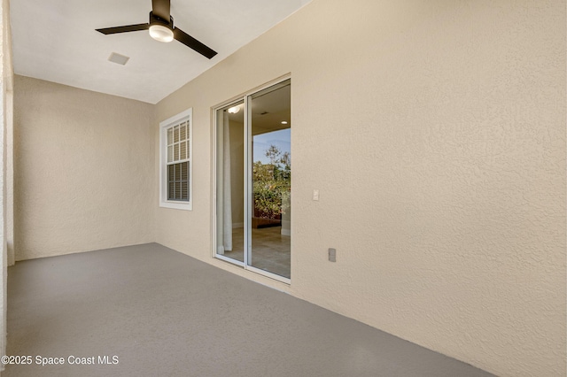 exterior space featuring ceiling fan