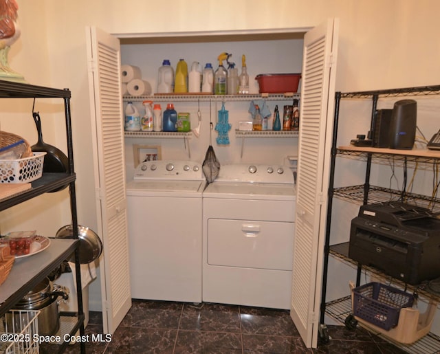 laundry area featuring laundry area, washer and clothes dryer, and marble finish floor