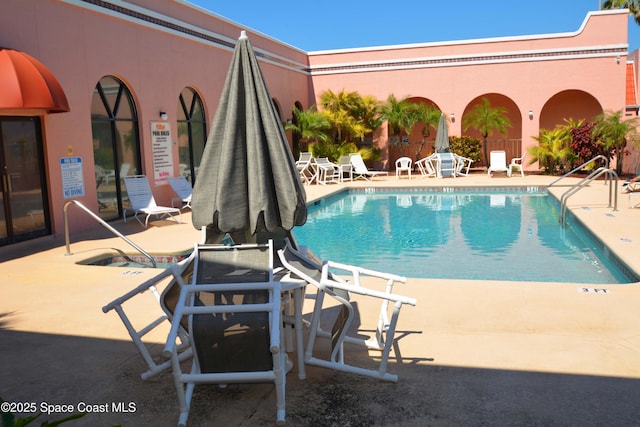 community pool with a patio