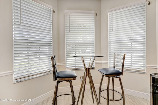 dining space featuring baseboards