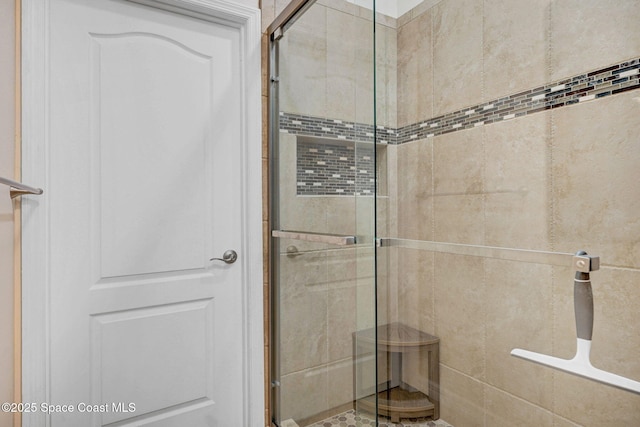 full bathroom featuring a stall shower