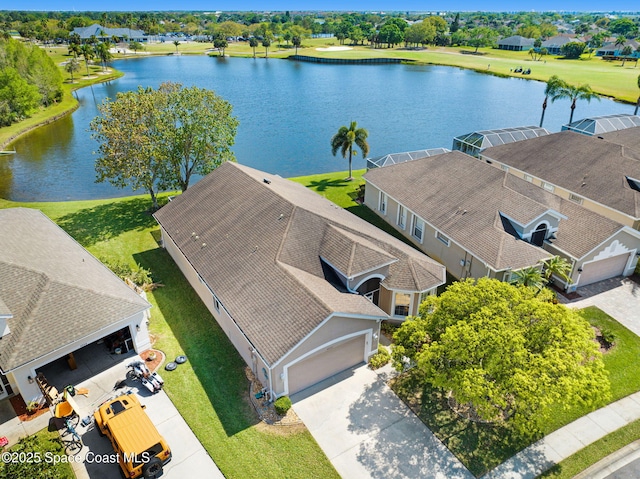 birds eye view of property with a water view and a residential view