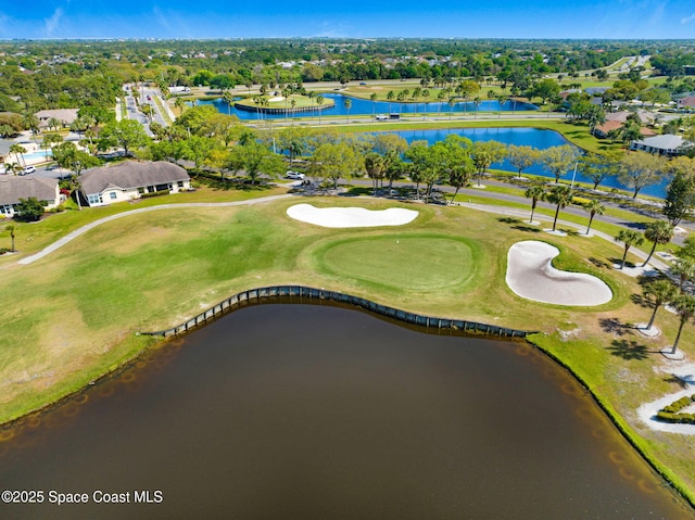 aerial view featuring a water view and view of golf course