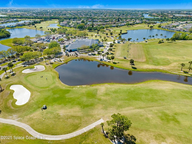 aerial view with a water view and view of golf course