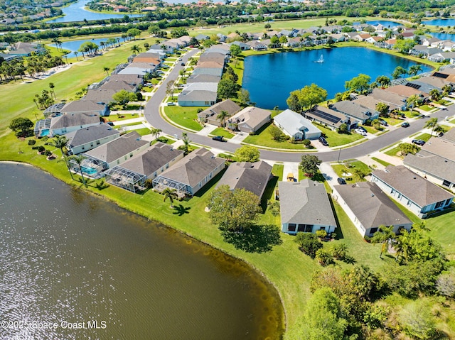 bird's eye view with a residential view and a water view