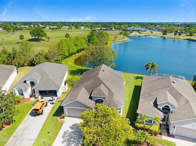 birds eye view of property with a water view