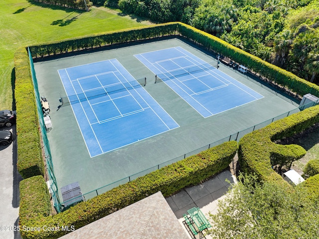 view of sport court featuring fence