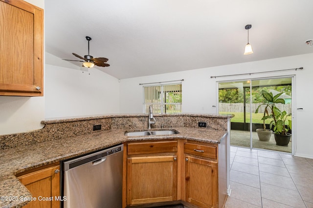 kitchen with light stone counters, hanging light fixtures, stainless steel dishwasher, a sink, and a peninsula