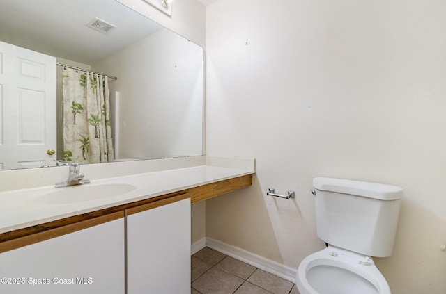 bathroom featuring visible vents, baseboards, toilet, tile patterned flooring, and vanity