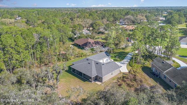 aerial view with a wooded view