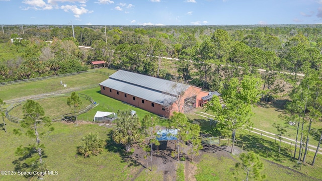 bird's eye view with a rural view and a wooded view