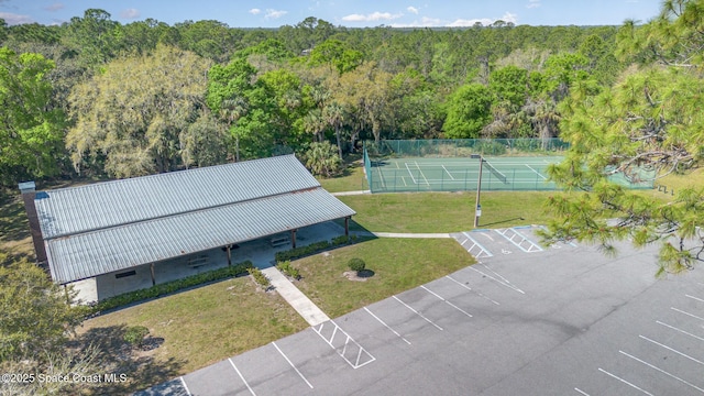 aerial view featuring a wooded view