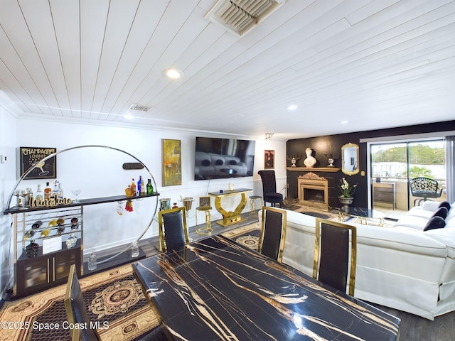 living area with wooden ceiling, recessed lighting, a fireplace, visible vents, and crown molding