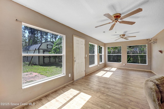 unfurnished sunroom featuring plenty of natural light