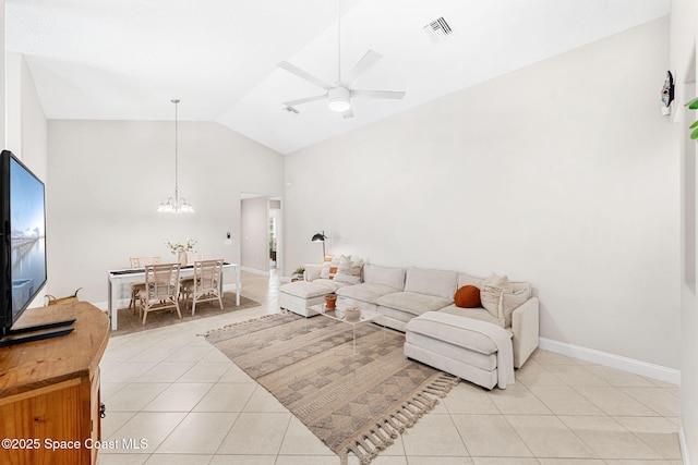 living room with lofted ceiling, visible vents, light tile patterned flooring, baseboards, and ceiling fan with notable chandelier