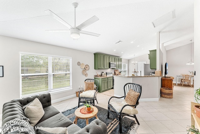 living room featuring visible vents, light tile patterned flooring, vaulted ceiling, a textured ceiling, and ceiling fan with notable chandelier