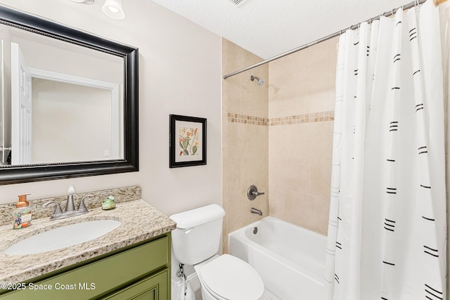 bathroom featuring toilet, shower / tub combo, a textured ceiling, and vanity