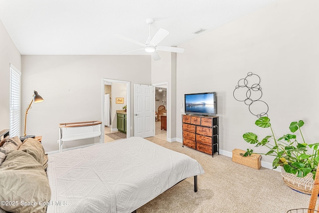 bedroom with high vaulted ceiling, connected bathroom, light colored carpet, visible vents, and baseboards